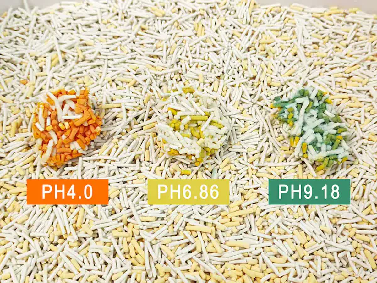 Tofu-based health monitoring litter: pH 4.0 acidic reaction (orange), pH 6.86 healthy (yellow), pH 9.18 alkaline reaction (green)